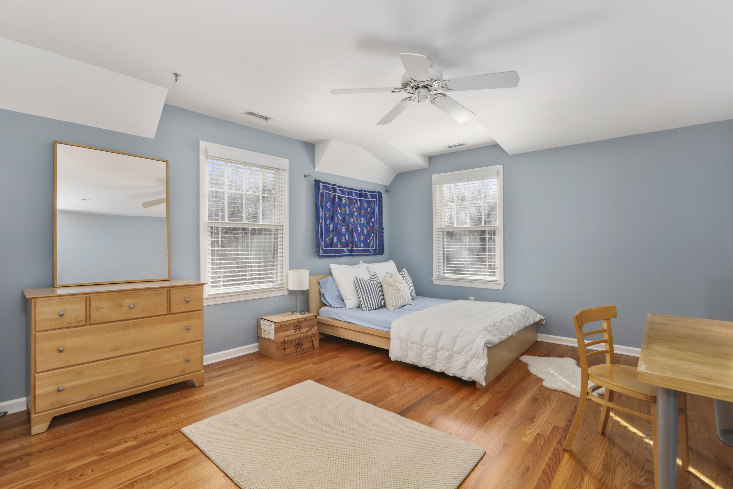 38 Intervale Road Darien, CT 06820 - Photo 18 of 30 a bedroom with a bed and wooden floor