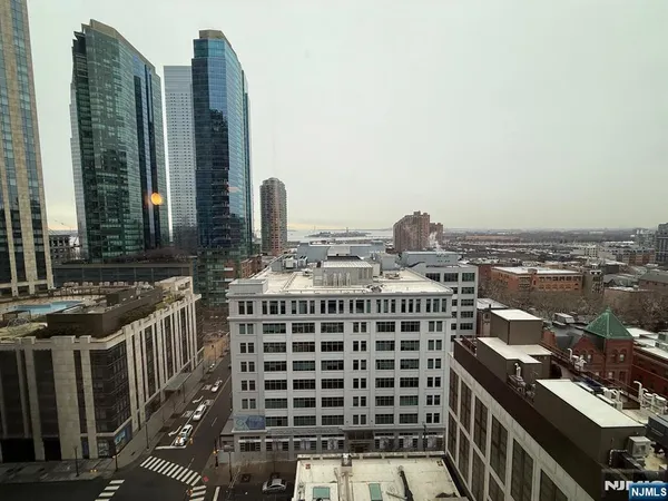 a view of a city with tall buildings