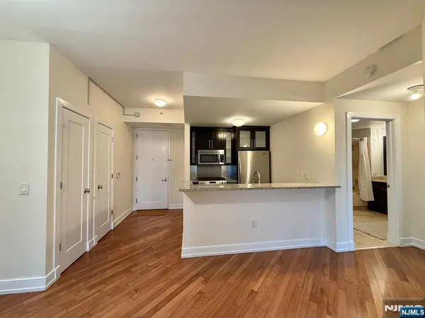 a view of a kitchen cabinets and wooden floor