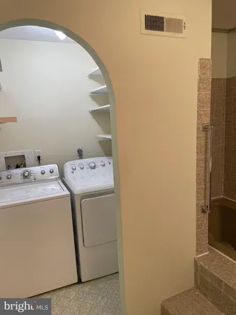 a utility room with dryer and washer