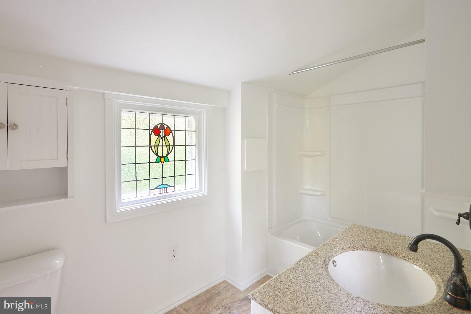 1321 Wyomissing Road Mohnton, PA 19540 - Photo 22 of 30 a bathroom with a sink and a bathtub