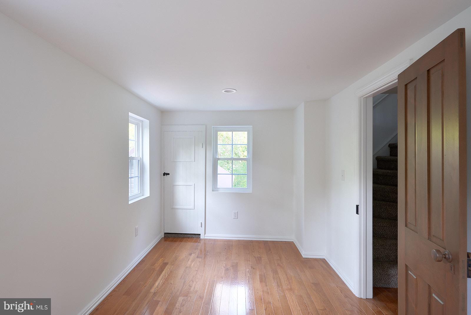 1321 Wyomissing Road Mohnton, PA 19540 - Photo 23 of 30 an empty room with wooden floor and windows