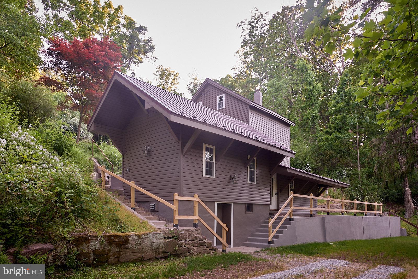 1321 Wyomissing Road Mohnton, PA 19540 - Photo 8 of 30 a front view of a house with a yard