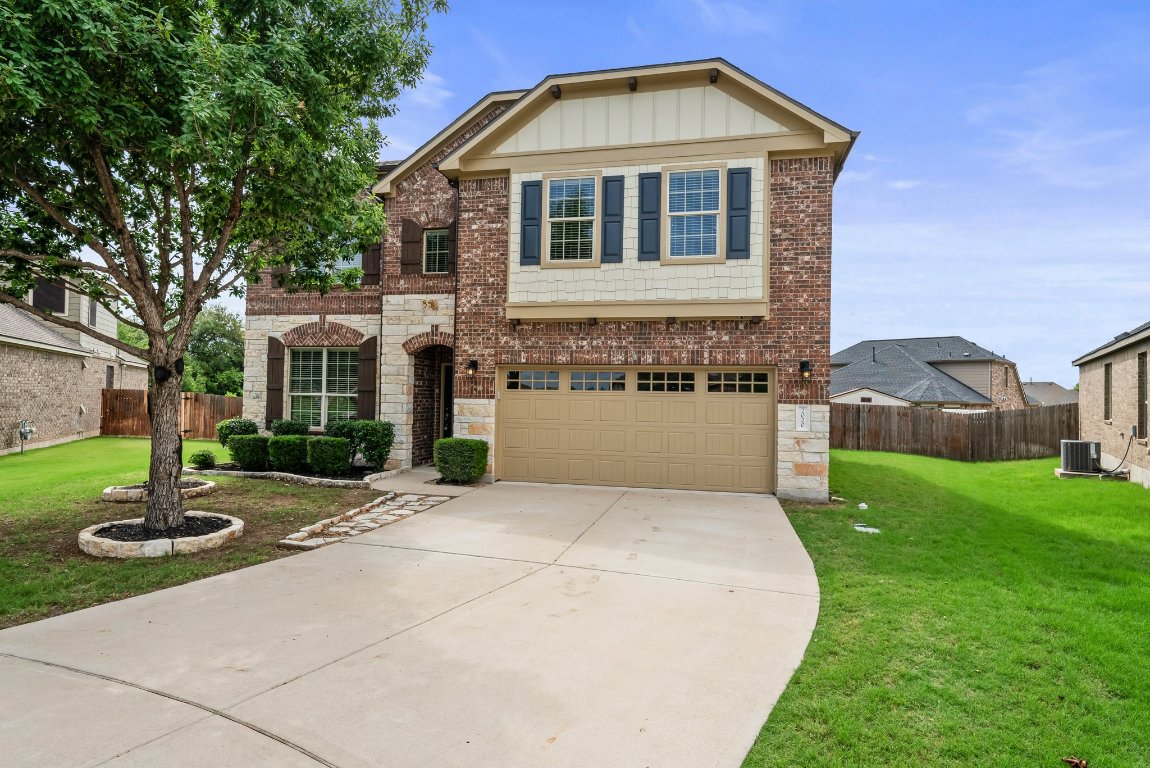 a front view of a house with a yard