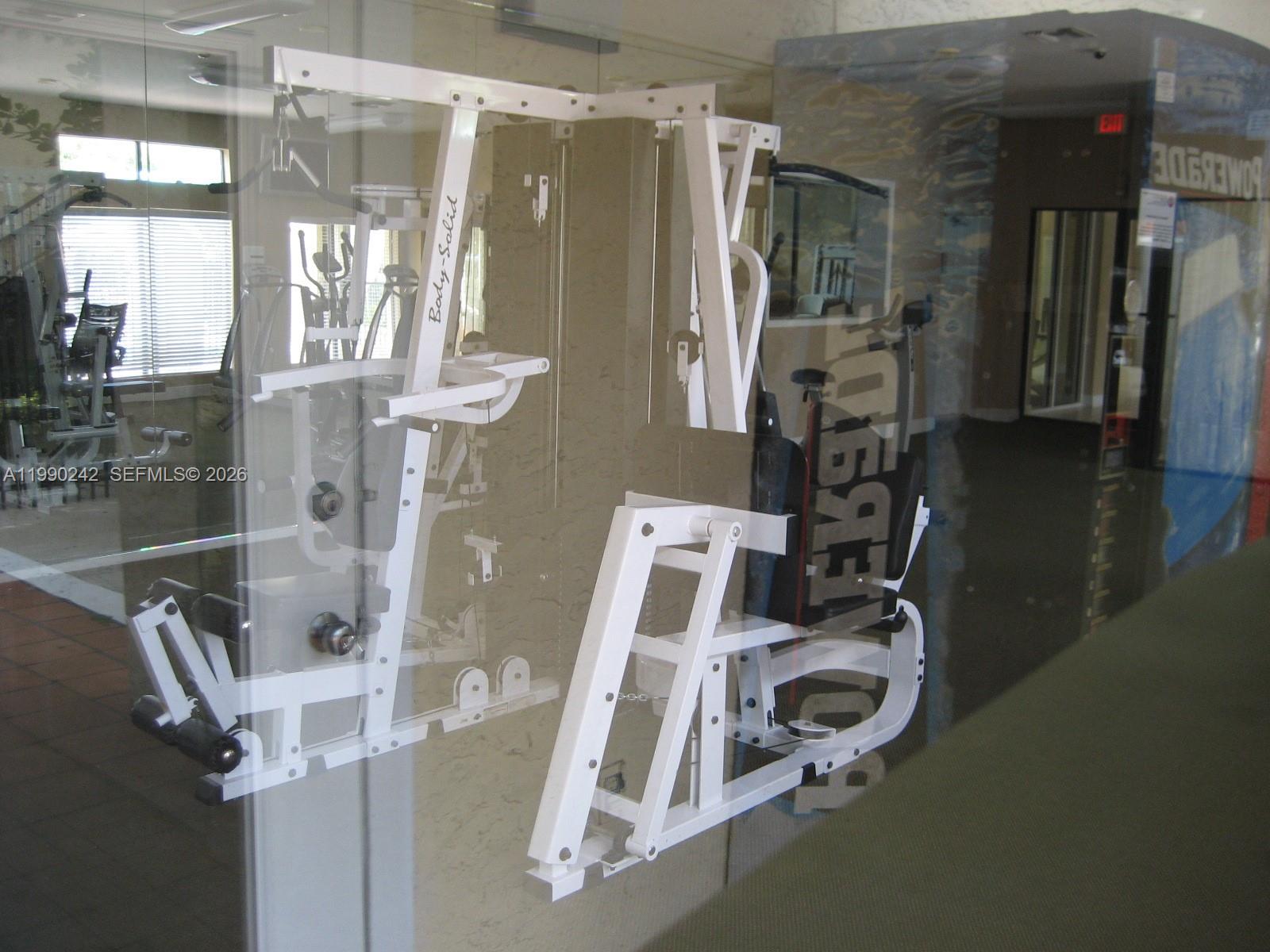 15051 Southwest 103rd Lane, Unit 4103 Miami, FL 33196 - Photo 13 of 19 a view of a room with gym equipment