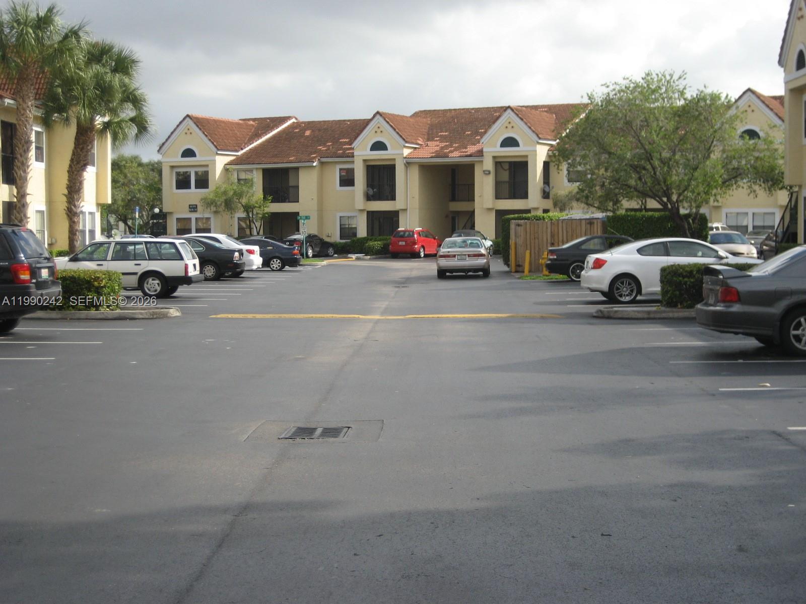 15051 Southwest 103rd Lane, Unit 4103 Miami, FL 33196 - Photo 19 of 19 a view of a city street with cars