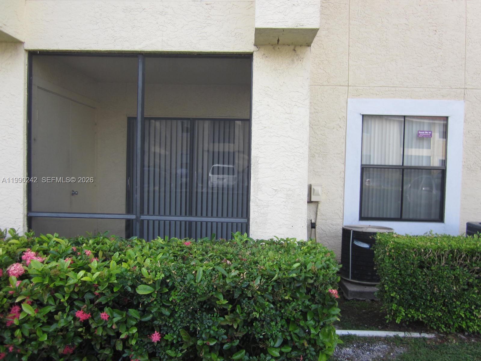 15051 Southwest 103rd Lane, Unit 4103 Miami, FL 33196 - Photo 10 of 19 front view of a house