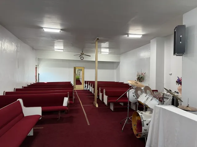 a room with furniture a flat screen tv and a chandelier