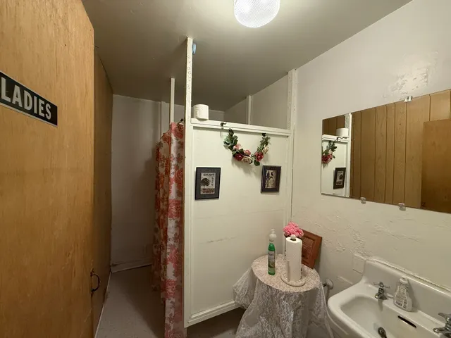 a bathroom with a sink and mirror