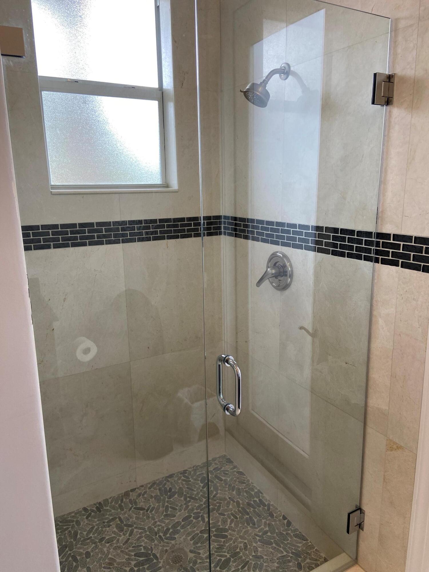 16456 Braeburn Ridge Trail Delray Beach, FL 33446 - Photo 12 of 25 a bathroom with a shower