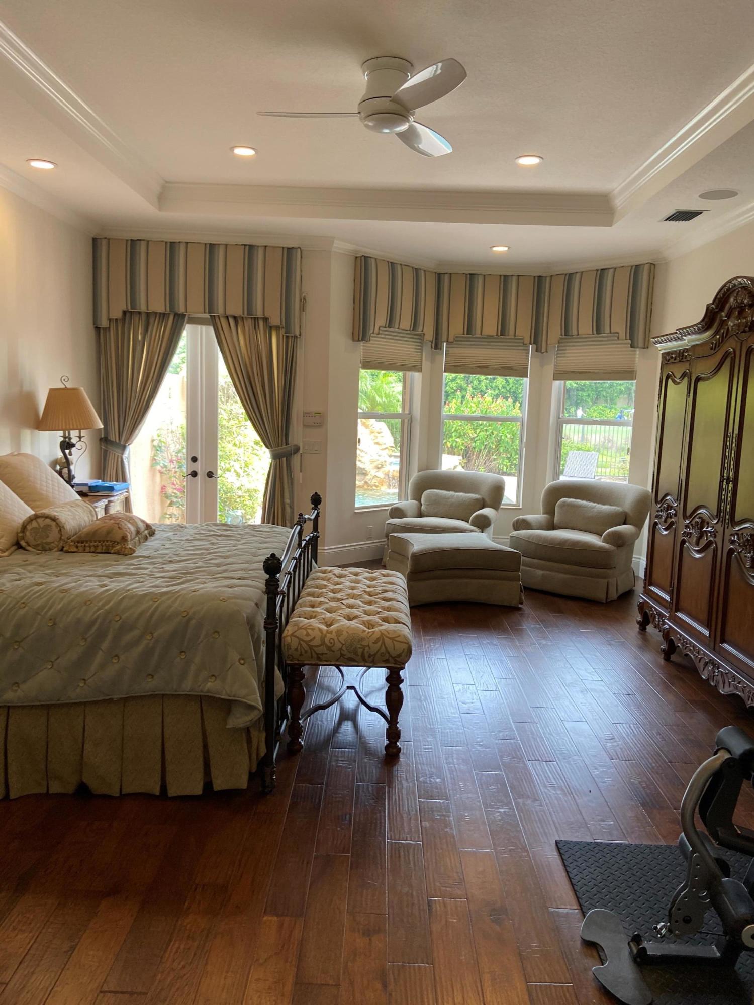 16456 Braeburn Ridge Trail Delray Beach, FL 33446 - Photo 17 of 25 a bedroom with bed window and a couch