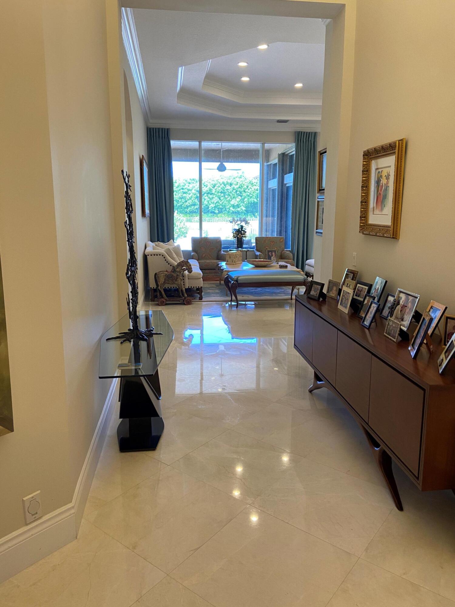 16456 Braeburn Ridge Trail Delray Beach, FL 33446 - Photo 2 of 25 a living room with furniture and a large window