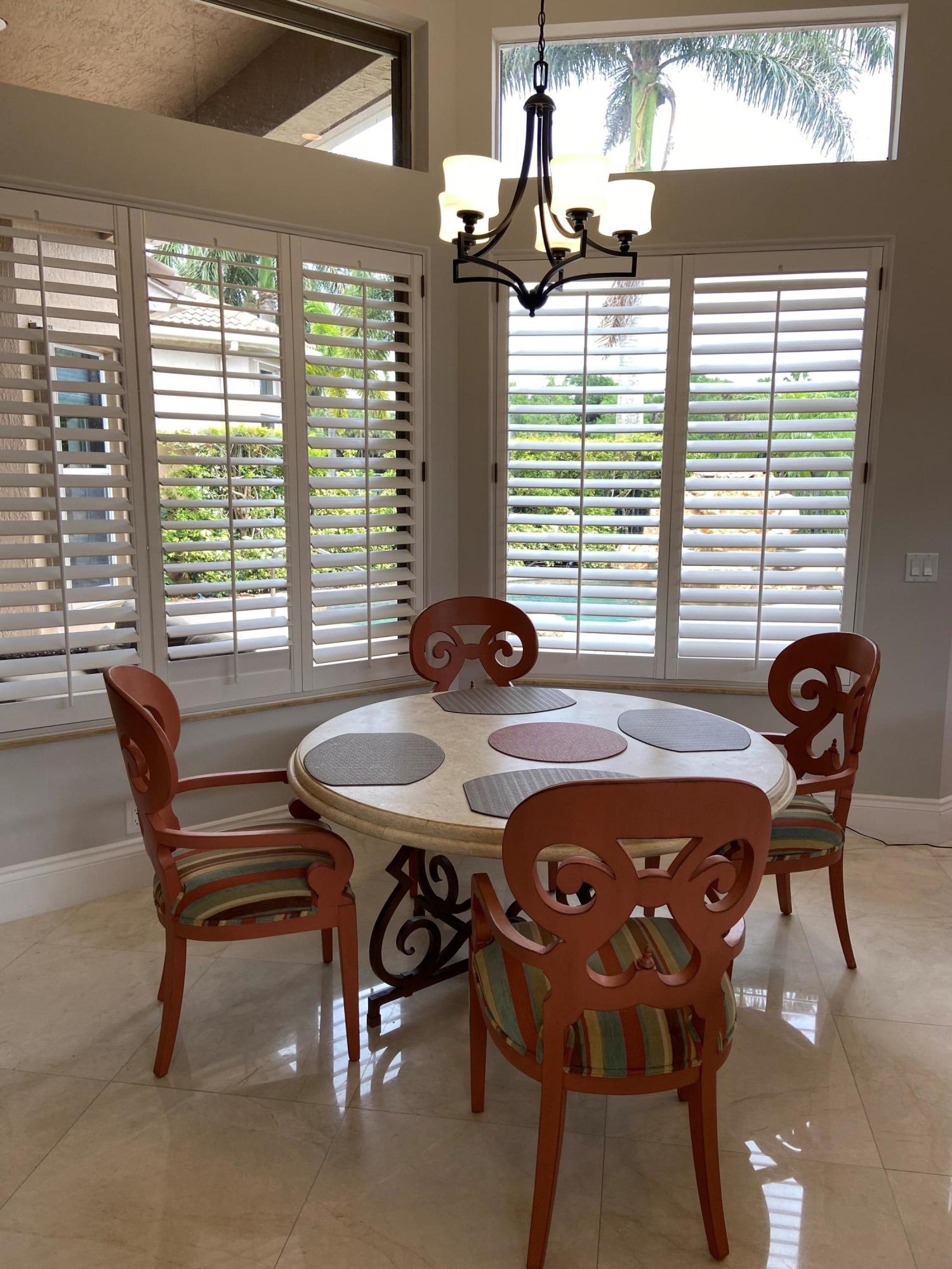 16456 Braeburn Ridge Trail Delray Beach, FL 33446 - Photo 22 of 25 a view of a dining room with furniture and window