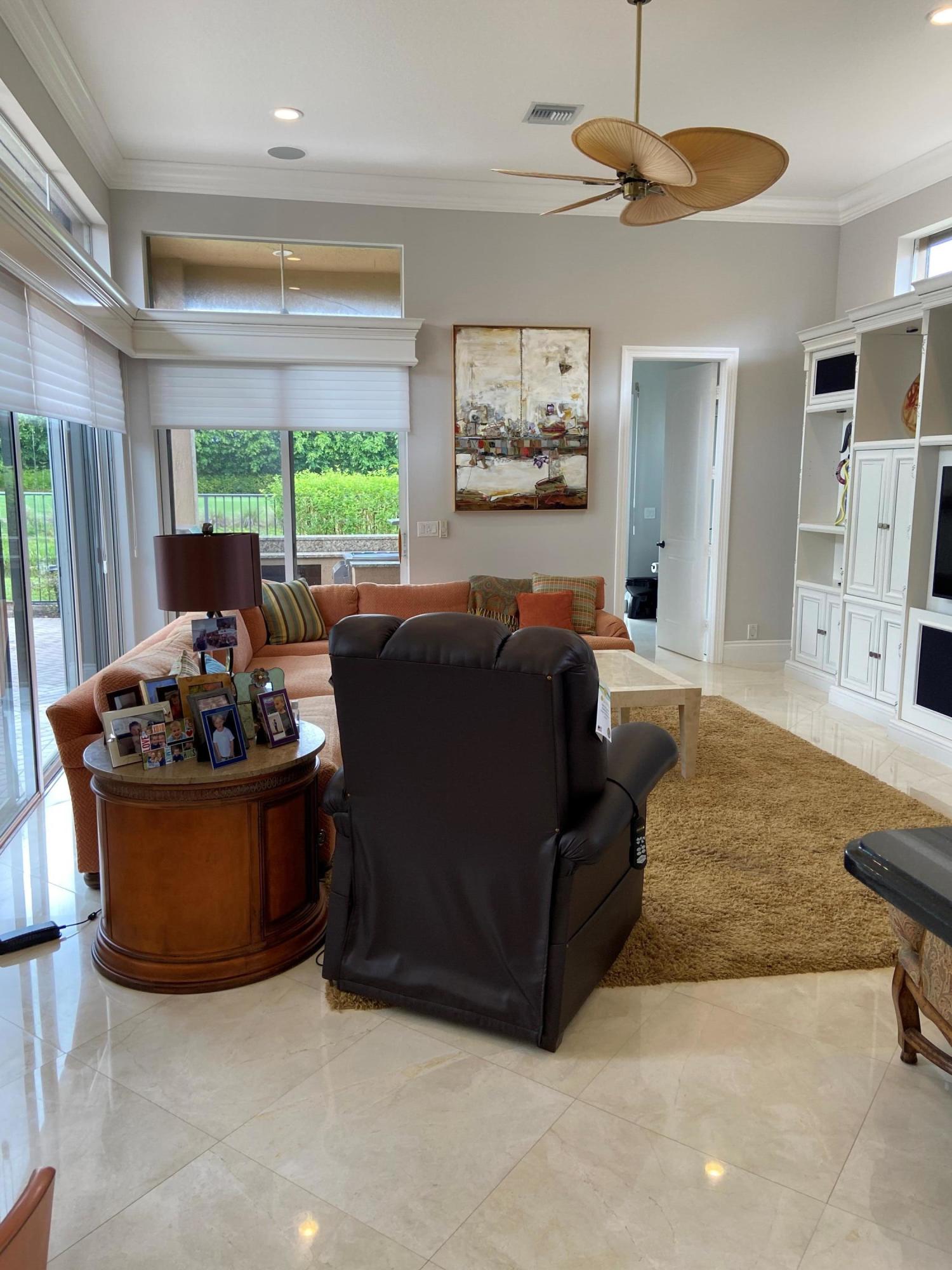 16456 Braeburn Ridge Trail Delray Beach, FL 33446 - Photo 25 of 25 a living room with furniture and a large window
