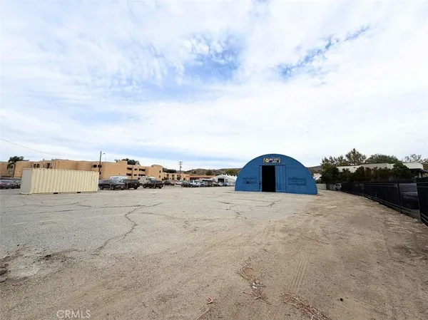 a view of a house with a snow in the background