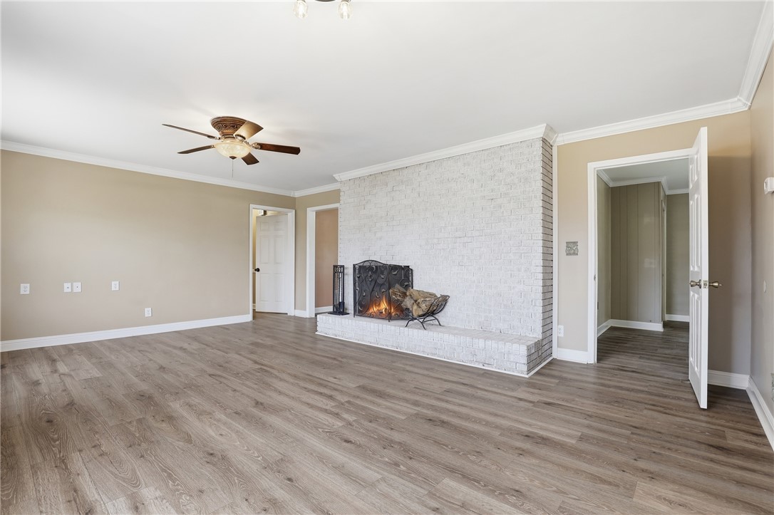 4304 Old Buncombe Road Greenville, SC 29617 - Photo 8 of 49 This inviting living space features an elegant fireplace, ready for cozy evenings.