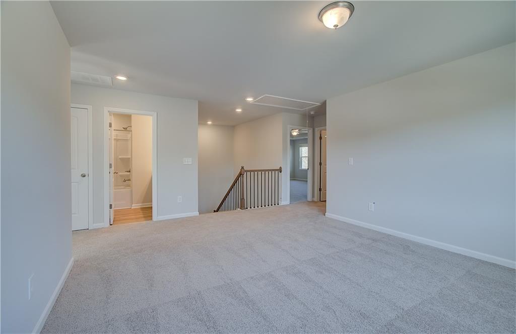 257 Chiswick Loop Stockbridge, GA 30281 - Photo 18 of 32 a view of an empty room with a fan