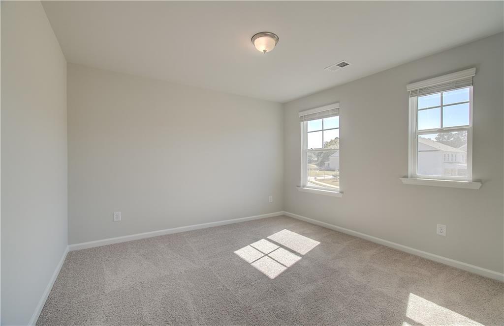 257 Chiswick Loop Stockbridge, GA 30281 - Photo 20 of 32 a view of empty room with window