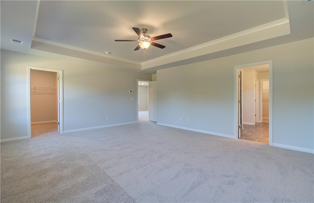 257 Chiswick Loop Stockbridge, GA 30281 - Photo 24 of 32 a view of an empty room with a chandelier fan