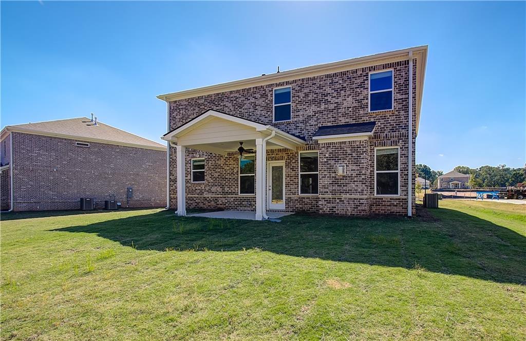 257 Chiswick Loop Stockbridge, GA 30281 - Photo 32 of 32 a view of a house with a yard