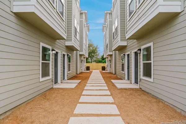 a view of a pathway with a house