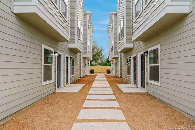 a view of a pathway with a house