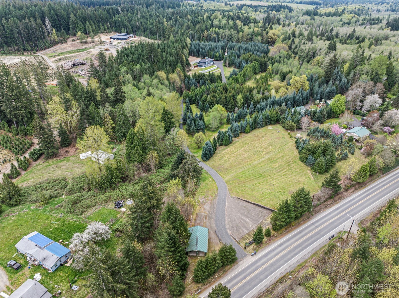 9611 West Belfair Valley Road Bremerton, WA 98312 - Photo 2 of 40 a view of a yard with plants