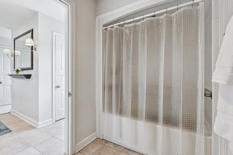 a bedroom with a bed and a book shelf
