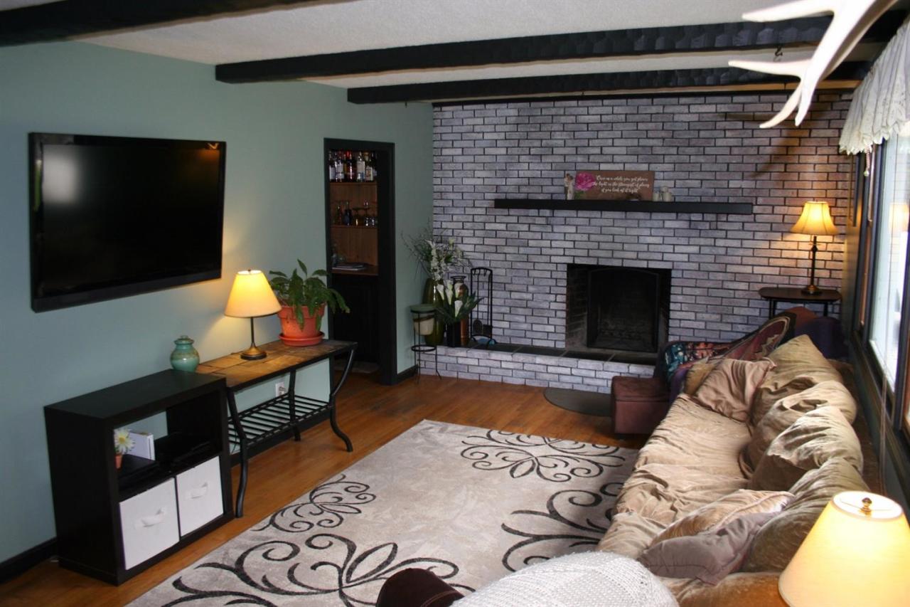 35 Chatham Lane Mashpee, MA 02649 - Photo 15 of 16 a living room with furniture flat screen tv and a fireplace