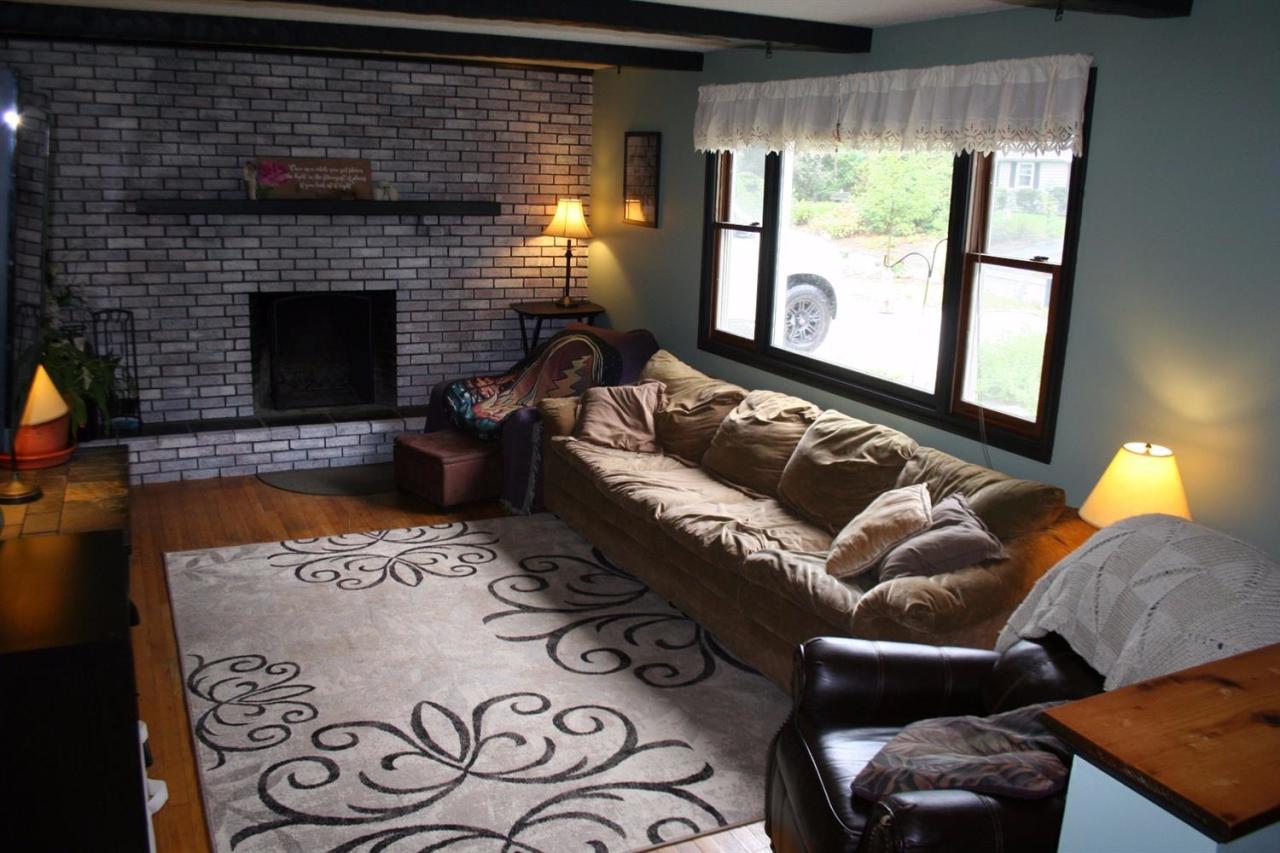35 Chatham Lane Mashpee, MA 02649 - Photo 16 of 16 a living room with furniture and a fireplace