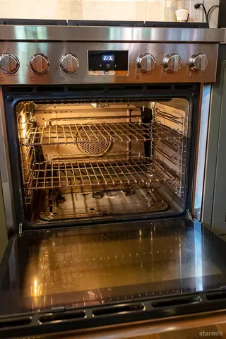 a kitchen with a refrigerator and cabinets