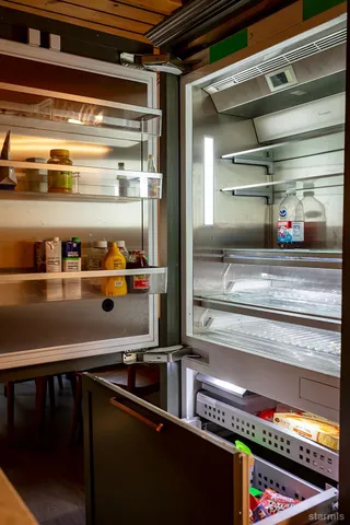 a view of storage and utility room with a sink
