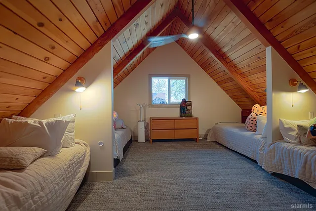 a living room with furniture and a stair