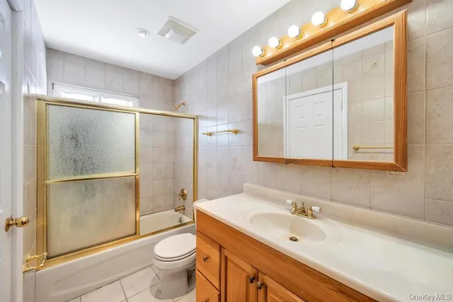 a bedroom with a large bed and a dresser