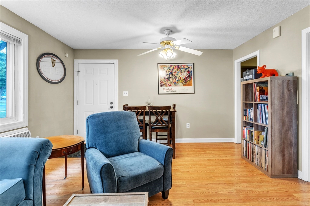 123 Outer Drive, Unit 123 Chicopee, MA 01022 - Photo 11 of 33 a living room with furniture and a book shelf