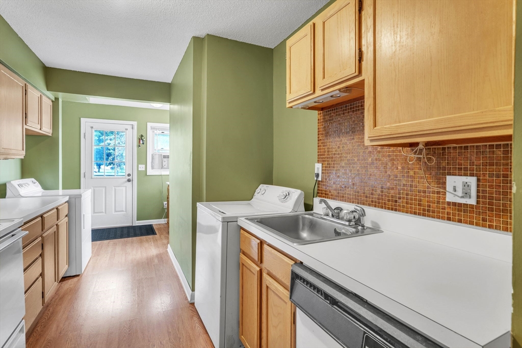 123 Outer Drive, Unit 123 Chicopee, MA 01022 - Photo 15 of 33 a kitchen that has a sink and a stove
