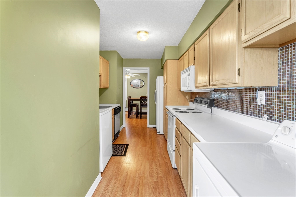 123 Outer Drive, Unit 123 Chicopee, MA 01022 - Photo 18 of 33 a kitchen with a sink and wooden floor