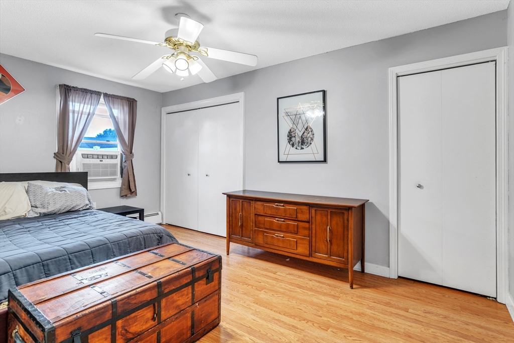 123 Outer Drive, Unit 123 Chicopee, MA 01022 - Photo 20 of 33 a bedroom with a bed and a dresser