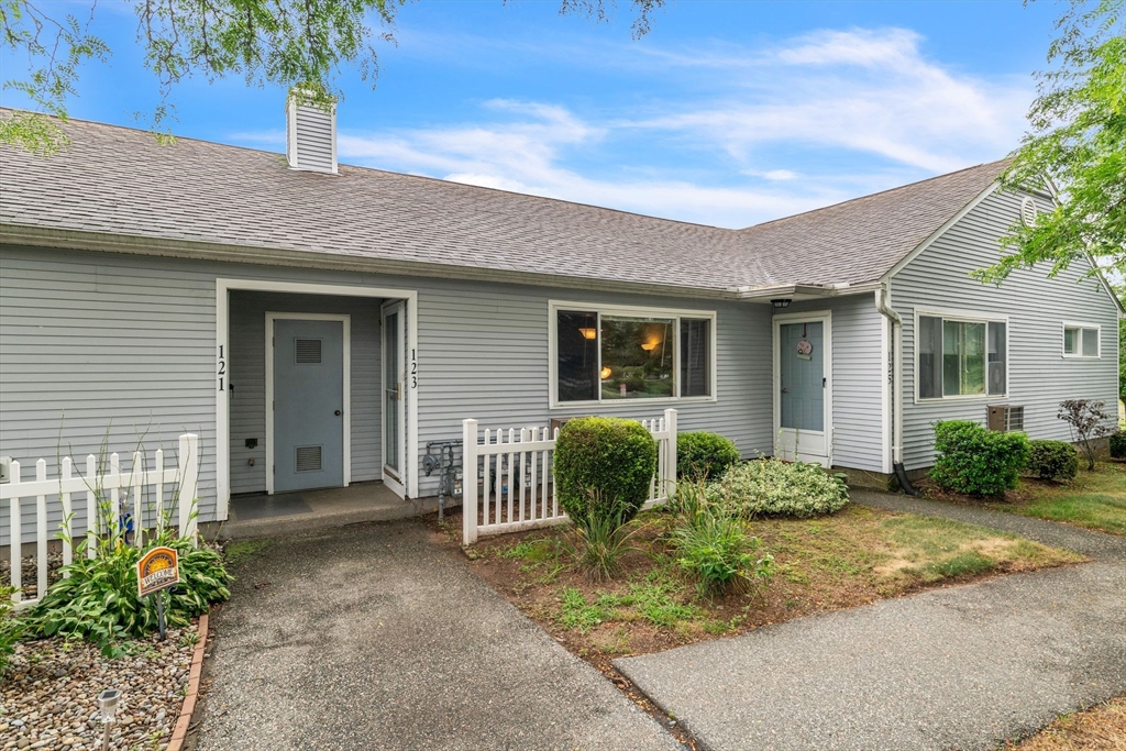 123 Outer Drive, Unit 123 Chicopee, MA 01022 - Photo 2 of 33 a front view of a house with garden