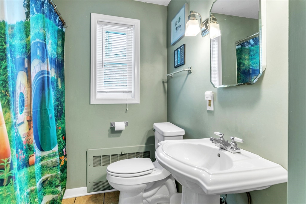 123 Outer Drive, Unit 123 Chicopee, MA 01022 - Photo 25 of 33 a bathroom with a sink toilet and mirror