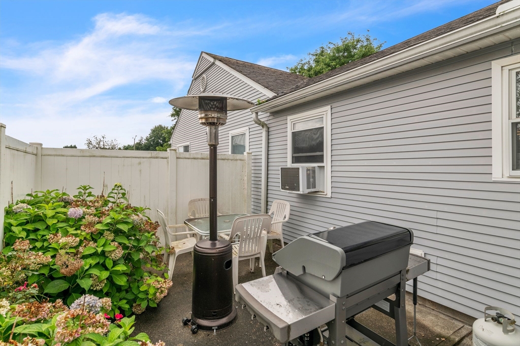123 Outer Drive, Unit 123 Chicopee, MA 01022 - Photo 26 of 33 a view of a chairs and table on the deck