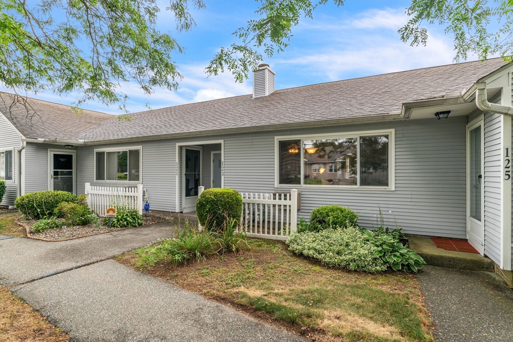 123 Outer Drive, Unit 123 Chicopee, MA 01022 - Photo 3 of 33 a front view of a house with garden
