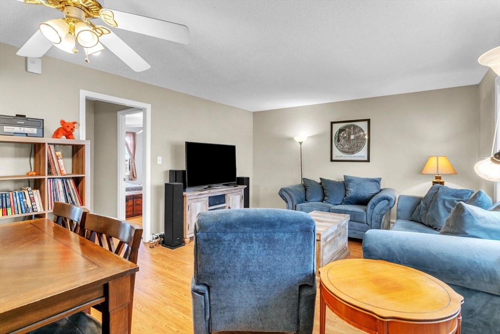 123 Outer Drive, Unit 123 Chicopee, MA 01022 - Photo 6 of 33 a living room with furniture and a flat screen tv