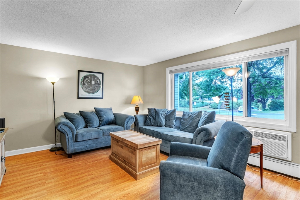 123 Outer Drive, Unit 123 Chicopee, MA 01022 - Photo 7 of 33 a living room with furniture and a large window