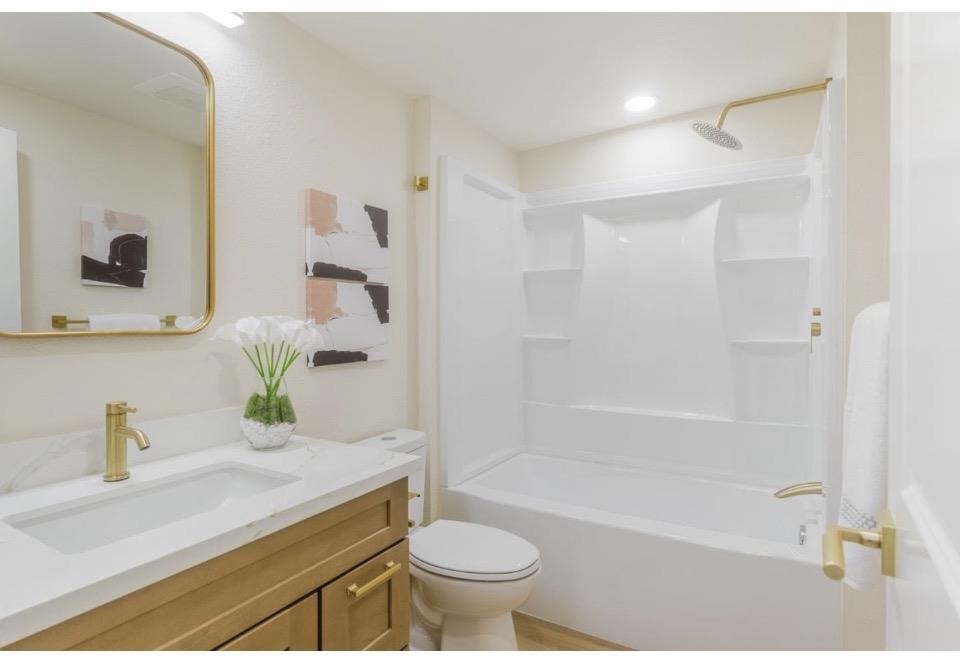735 Locust Street San Jose, CA 95110 - Photo 20 of 21 a bathroom with a sink a toilet and shower