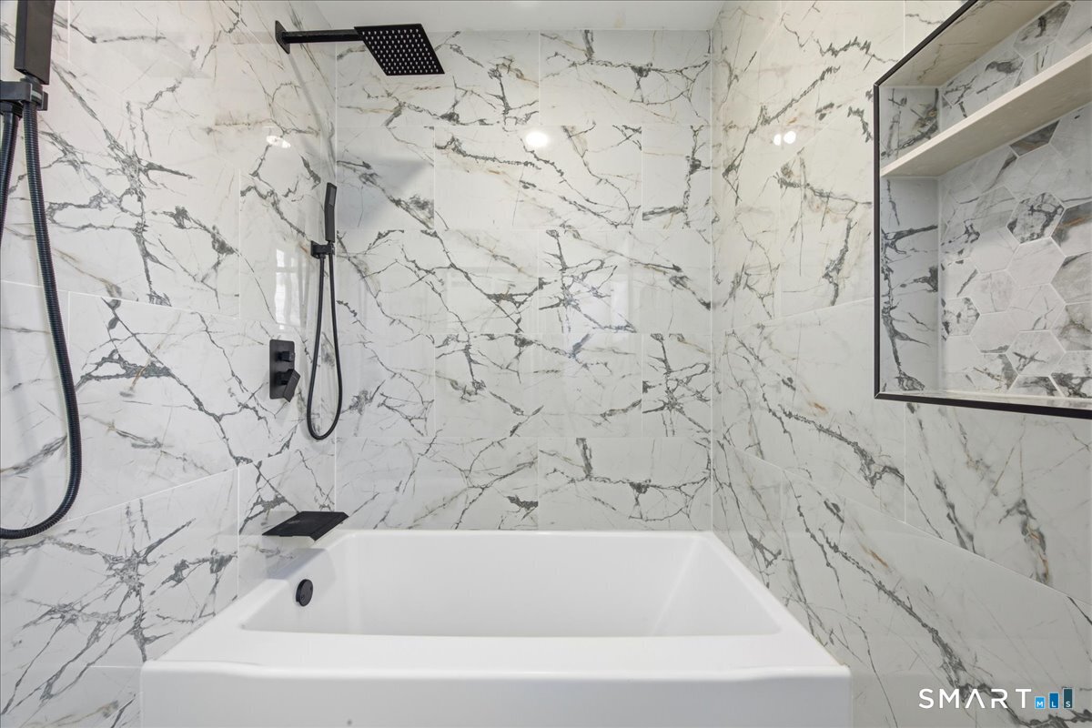 52 Coram Street Hamden, CT 06517 - Photo 31 of 40 a bathroom with a bathtub