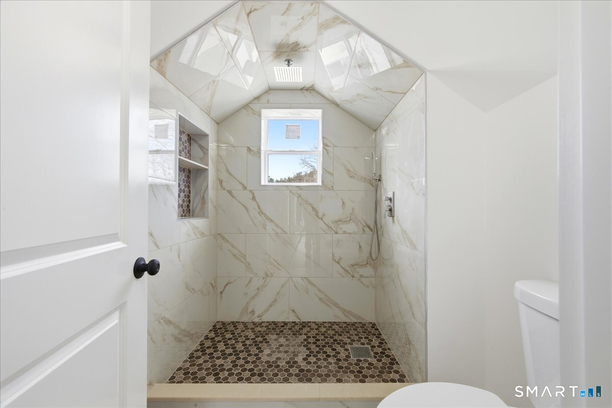 52 Coram Street Hamden, CT 06517 - Photo 35 of 40 a bathroom with a shower