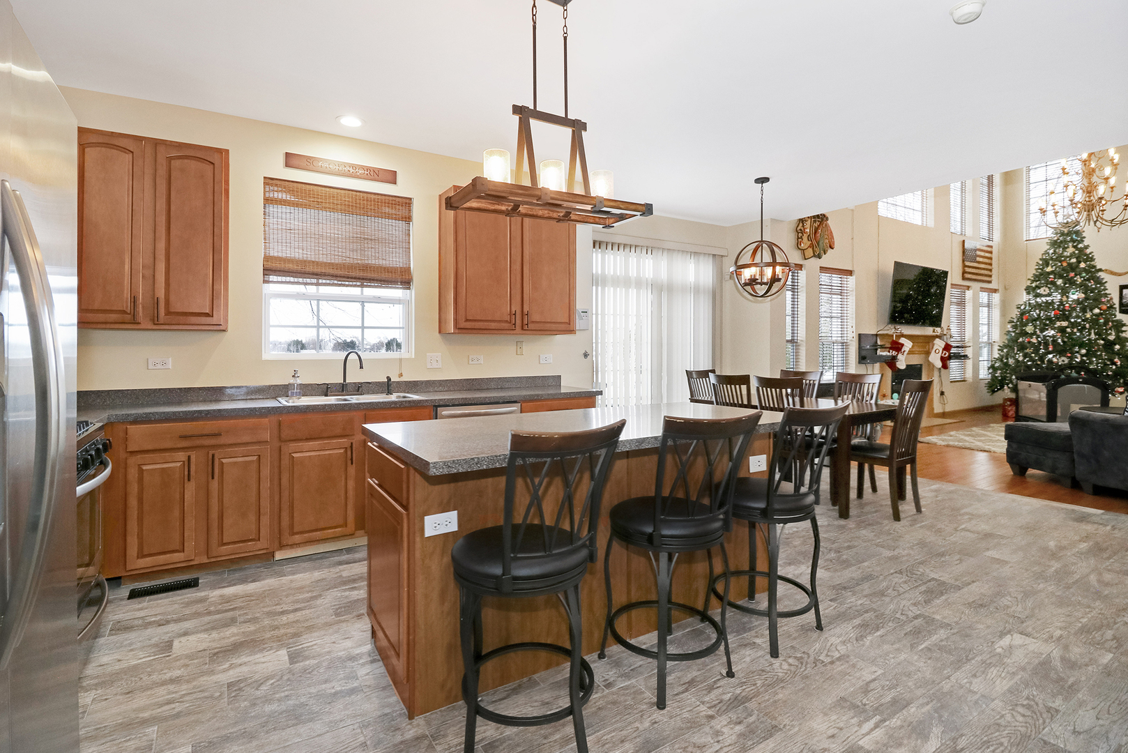 428 Cardinal Lane Bolingbrook, IL 60490 - Photo 16 of 36 a kitchen with a table chairs sink and cabinets