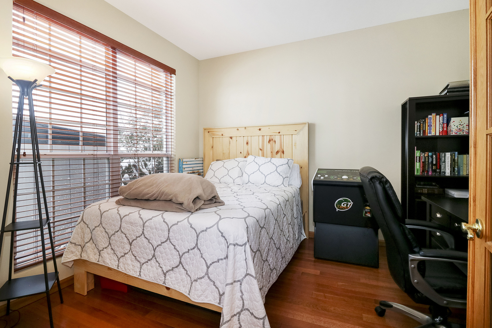 428 Cardinal Lane Bolingbrook, IL 60490 - Photo 22 of 36 a bedroom with a bed and a bookshelf