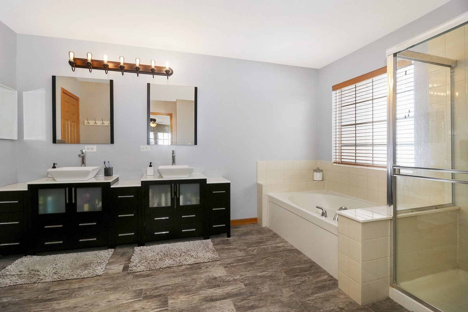428 Cardinal Lane Bolingbrook, IL 60490 - Photo 34 of 36 a bathroom with a tub sink and mirror
